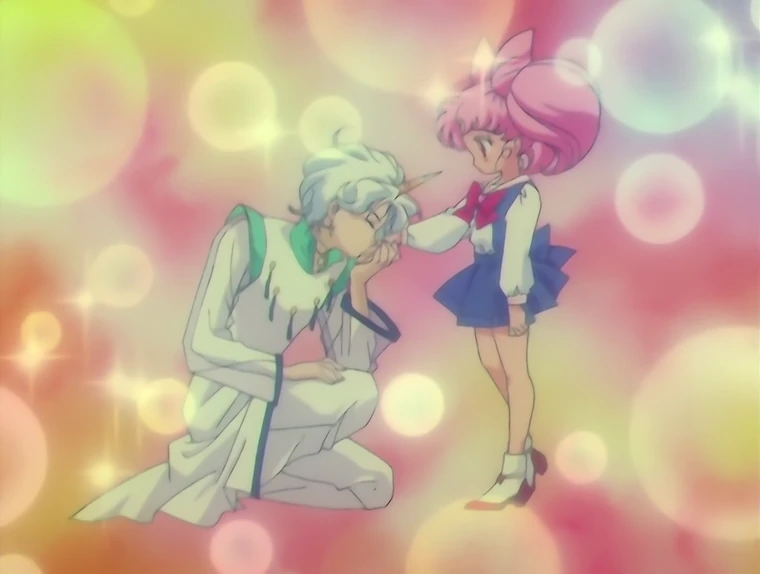 Helios in the 90s anime, kneeling and kissing Chibiusa&rsquo;s hand among soft circles of light