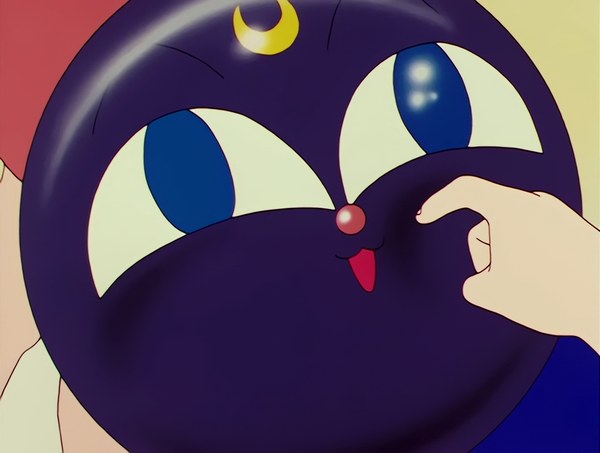 Luna-P, the floating ball painted with Luna&rsquo;s face, being poked on the nose.