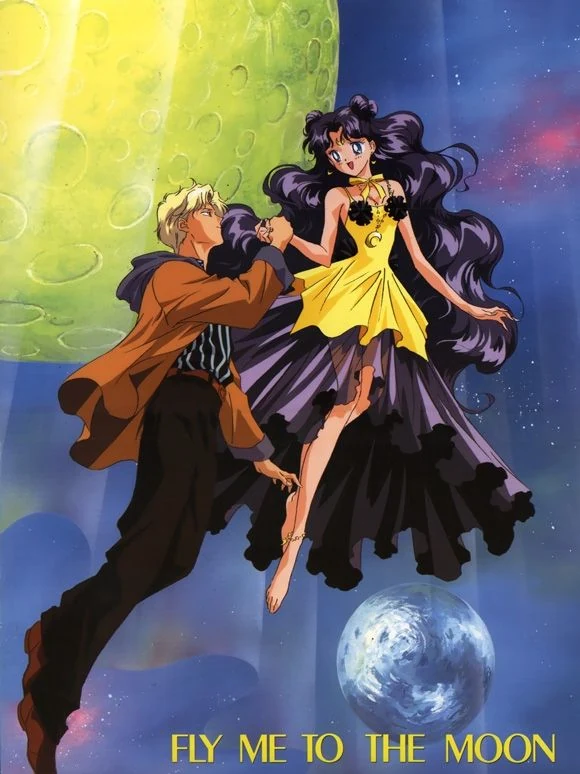 Luna in human form, in a yellow dress with long dark hair, flying hand in hand with Kakeru past the Earth, under the words FLY ME TO THE MOON