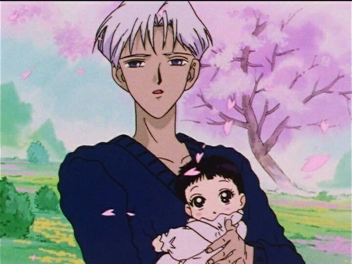 Professor Tomoe standing under a blossoming cherry tree holding the infant Hotaru in his arms