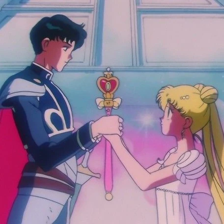 Prince Endymion and Princess Serenity from the 90s anime, both holding a heart-topped moon wand between them