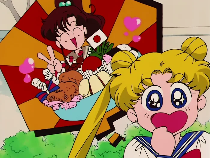 Makoto beaming behind an enormous parfait stacked with cake, fruit and a little flag, and Usagi undone by the sight of it