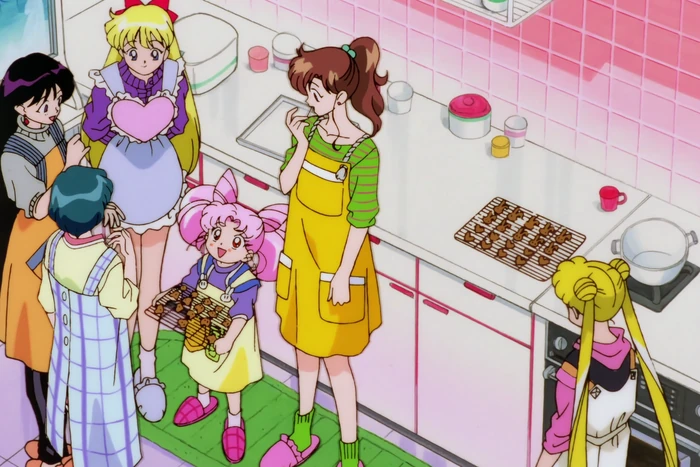 The whole group crowded into Makoto&rsquo;s kitchen in aprons, trays of rabbit-shaped cookies cooling on racks, Makoto tasting one while Chibi-Usa holds up a tray
