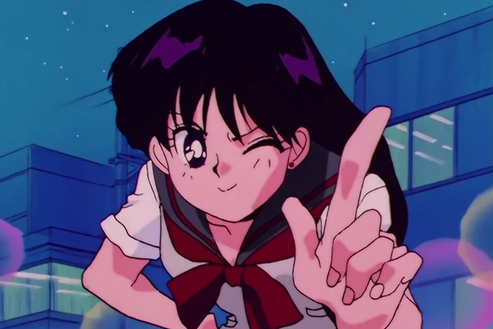 Rei in her school uniform at night, city buildings and a starry sky behind her, winking with one hand raised and the index finger pointing up