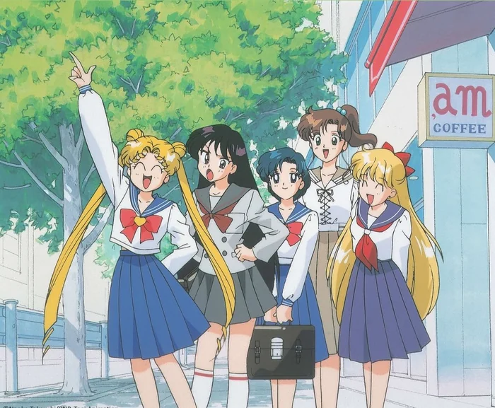The five guardians out of uniform on a sunny street corner, one of them laughing with an arm thrown up, another mid-protest, the other three grinning beside them