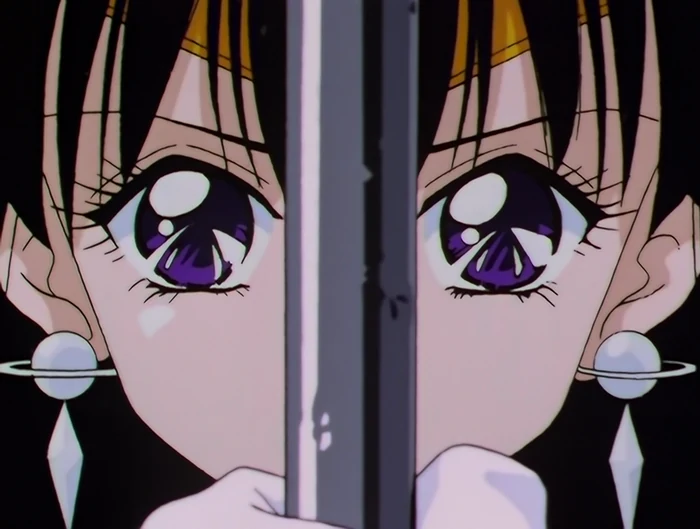 A tight close-up of Sailor Saturn holding the glaive upright in front of her face, the pale blade running between her eyes, a small ringed planet at each ear