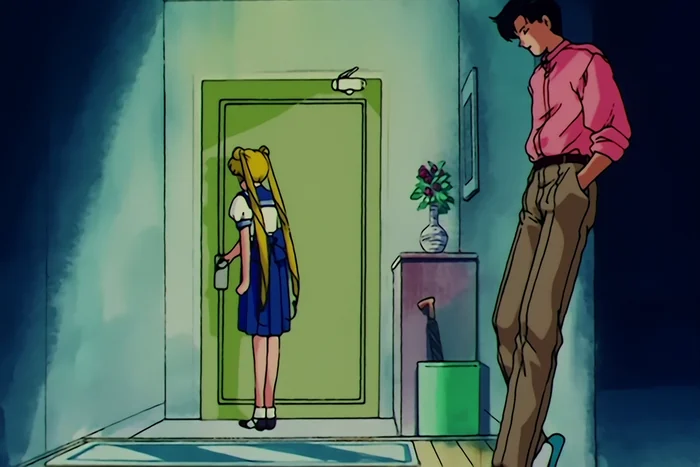 Usagi at a green front door with her hand on the handle and her back to Mamoru, who leans against the wall with his eyes down