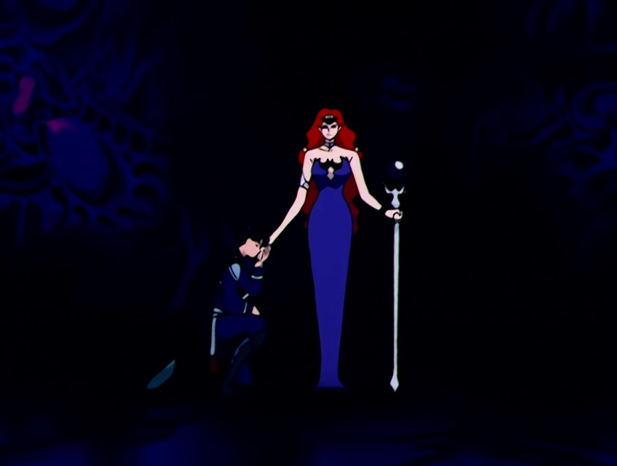 Queen Beryl standing in the dark of the Dark Kingdom, a general kneeling before her