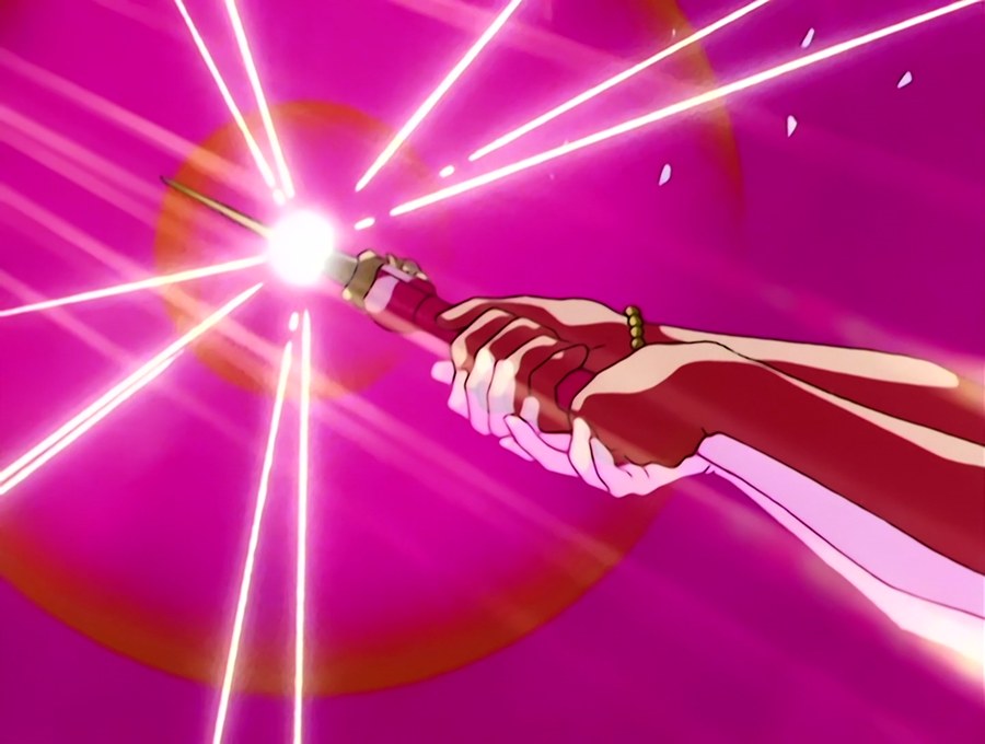 the Moon Stick in Sailor Moon&rsquo;s hands, the Silver Crystal blazing at its tip