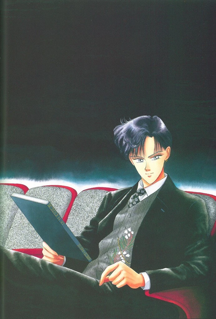 Takeuchi colour illustration of Mamoru in a dark suit and waistcoat, sitting alone in a row of red cinema seats with an open book in one hand, looking out at the reader
