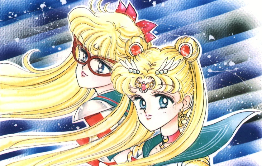 Sailor V and Sailor Moon shoulder to shoulder against a streaked blue sky, V behind in her red-framed mask with the crescent on her brow, Usagi in front in her tiara