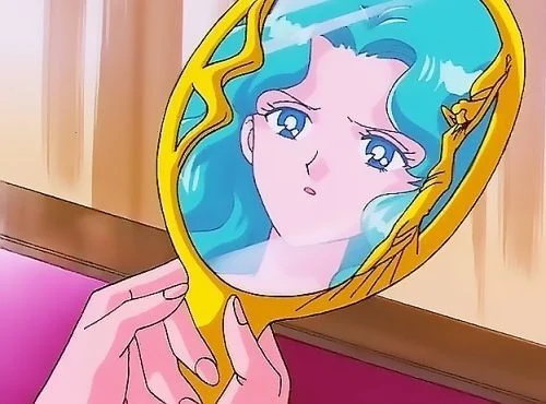 Michiru&rsquo;s face reflected in the Deep Aqua Mirror, held up in her own hand