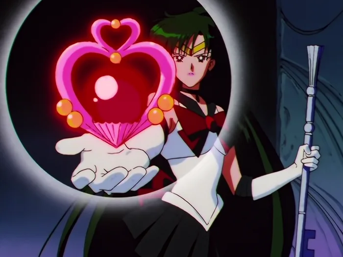 Sailor Pluto holding out one gloved hand with a glowing pink heart-shaped crystal above it, the Garnet Rod in her other hand, a dark halo behind her